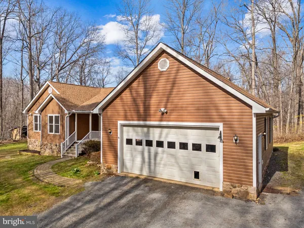 a living room with a fireplace and a table