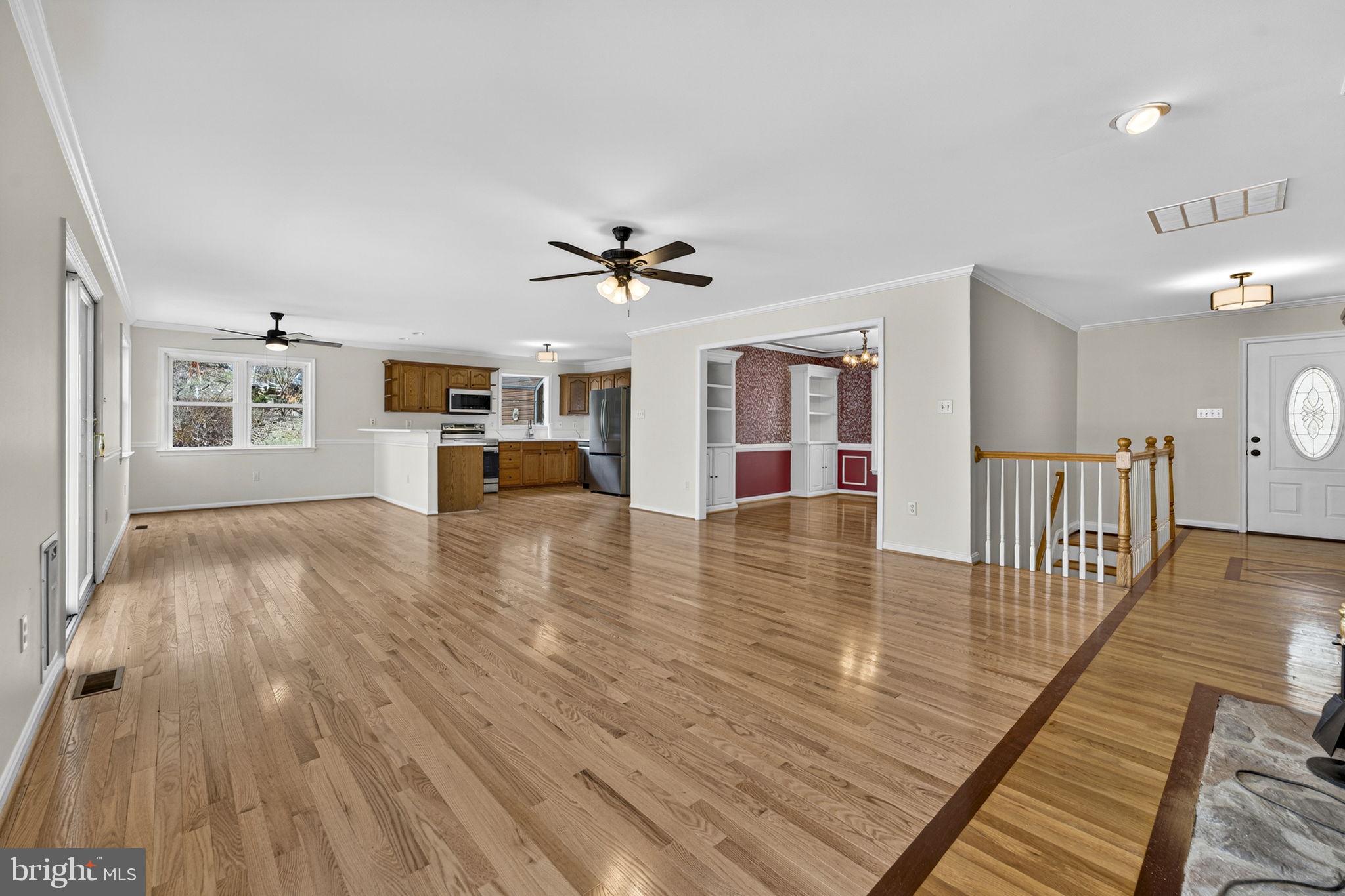 584 South Poes Road Amissville, VA 20106 - Photo 30 of 82 a view of a living room and kitchen with furniture wooden floor and window