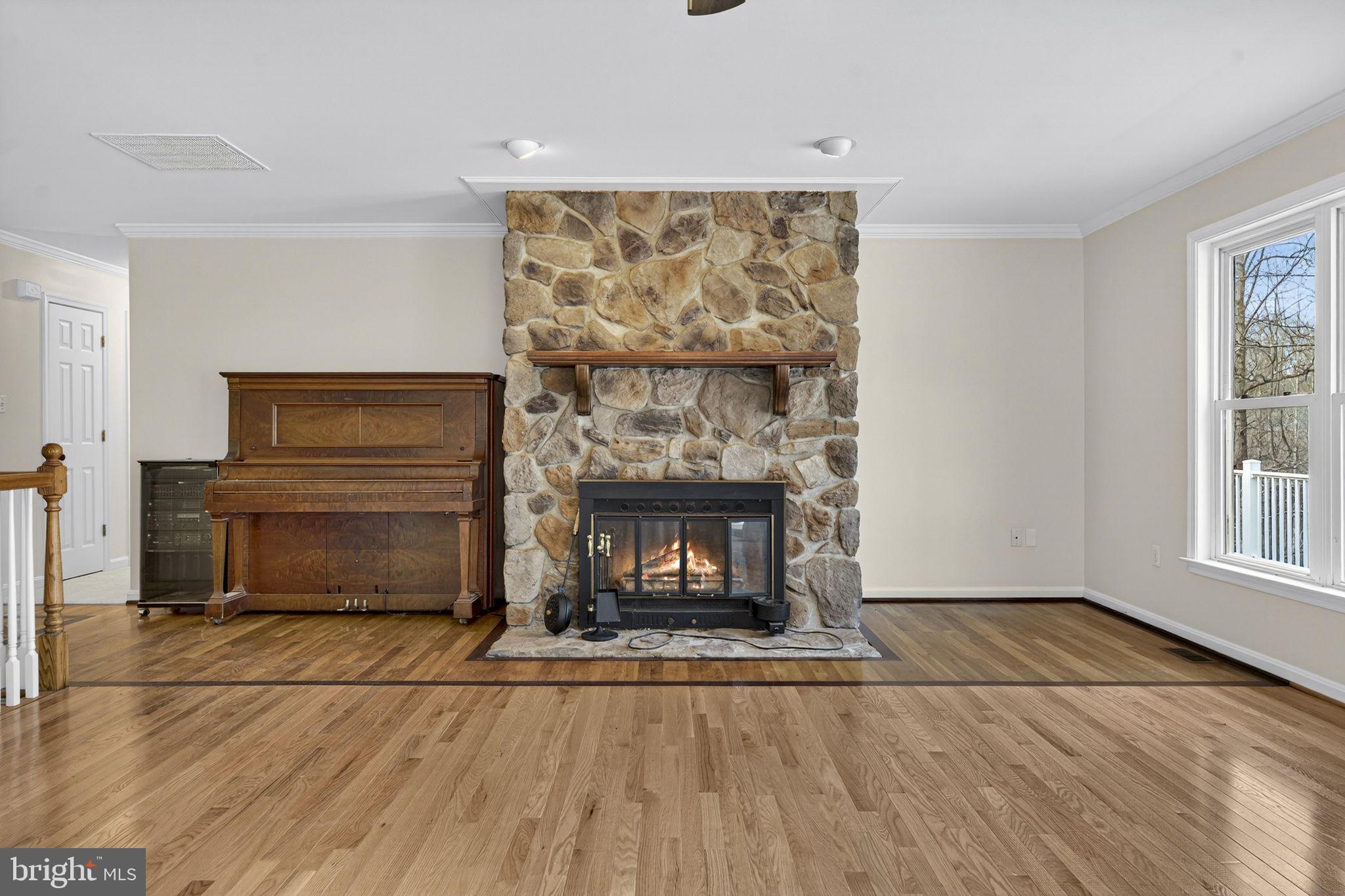 584 South Poes Road Amissville, VA 20106 - Photo 32 of 82 a living room with a fireplace and a table