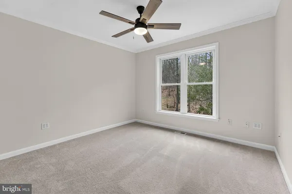 a view of backyard with a deck and wooden floor