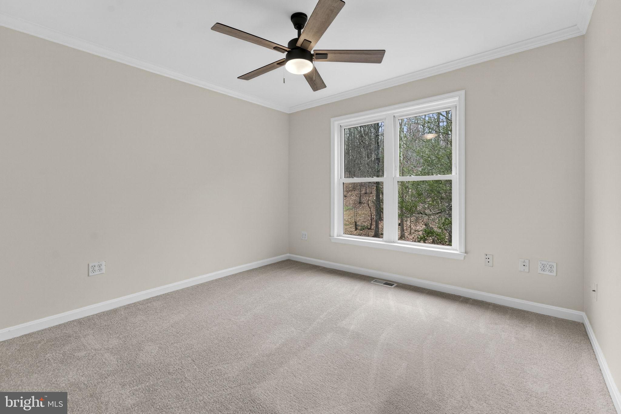 584 South Poes Road Amissville, VA 20106 - Photo 43 of 82 an empty room with a window and a fan