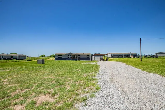 a view of a field with grass