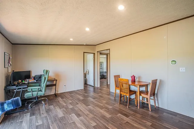 a workspace with furniture and wooden floor