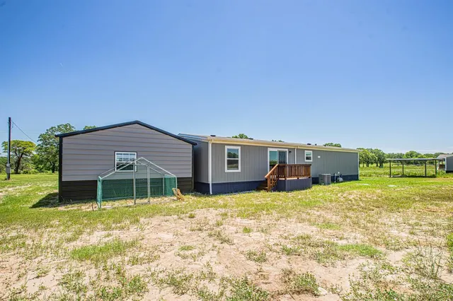 a house with yard in front of it