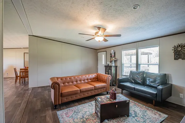 a bedroom with furniture and a chandelier