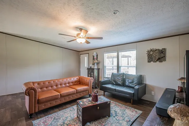 a bedroom with furniture and a chandelier