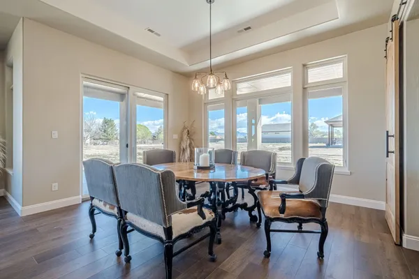 an empty room with a window and ceiling fan