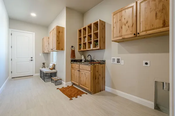 a white toilet sitting next to a bathroom sink