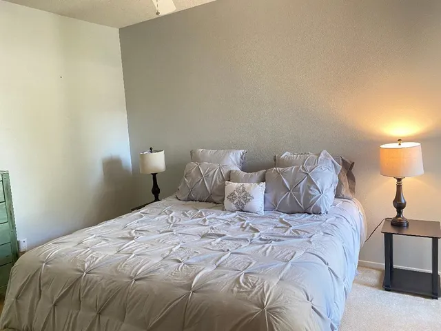 a front view of a house with a yard and a garage