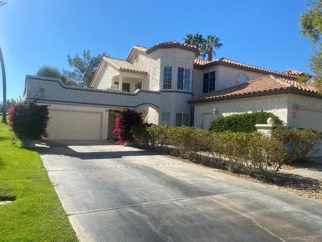 a view of a park with large trees