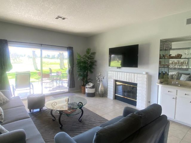 a view of a dining room with furniture and window