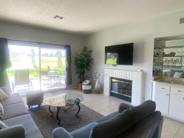 a view of a dining room with furniture and window