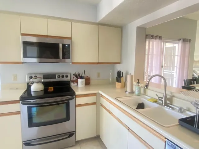a kitchen with a sink and cabinets