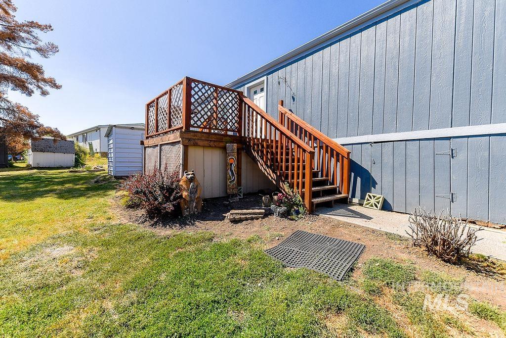 609 North Almon Street, Unit 3022 Moscow, ID 83843 - Photo 3 of 26 Back of property with a lawn and a wooden deck
