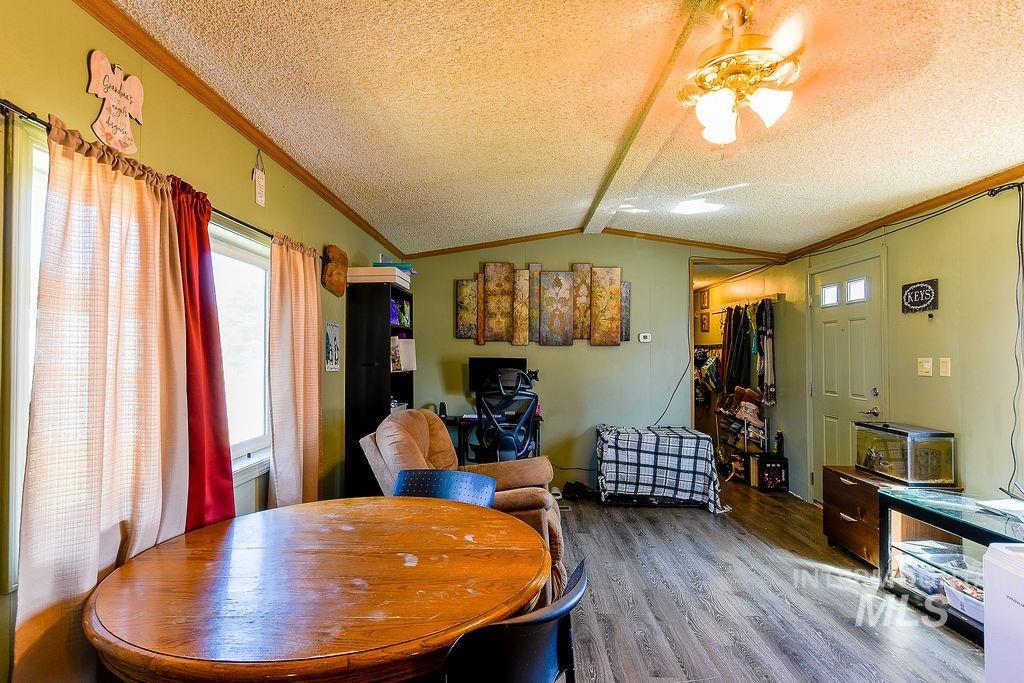 609 North Almon Street, Unit 3022 Moscow, ID 83843 - Photo 6 of 26 Dining area featuring ornamental molding, wood finished floors, and a ceiling fan