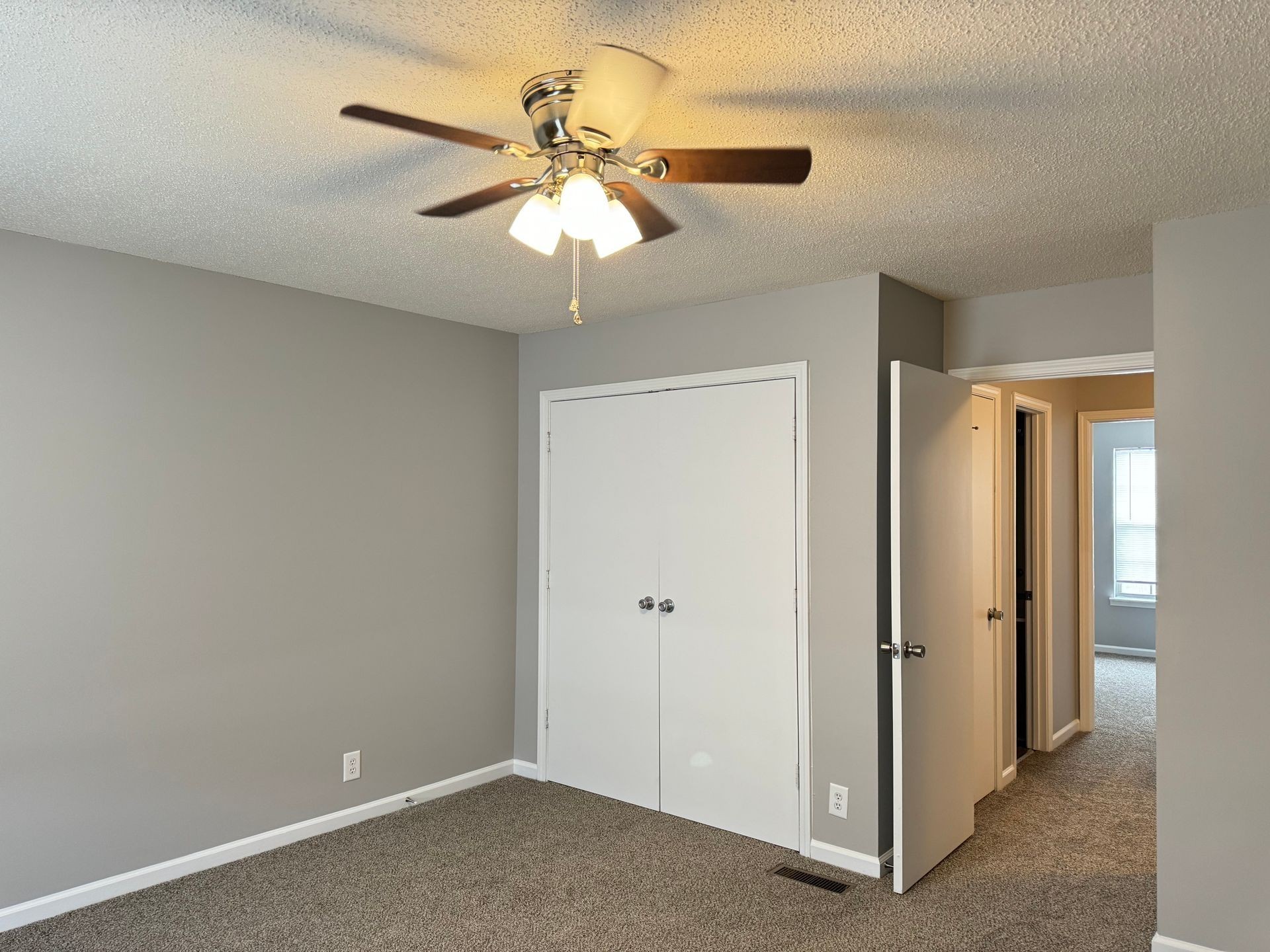 2453 Wilson Road, Unit 4 Clarksville, TN 37043 - Photo 14 of 20 an empty room with a fan and a fan