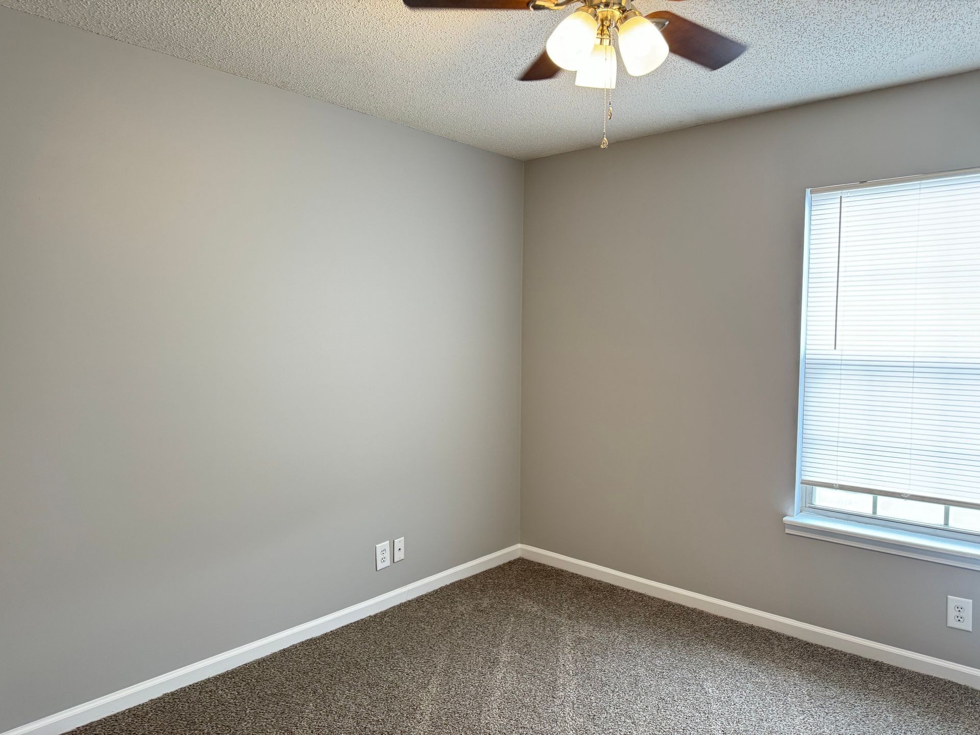 2453 Wilson Road, Unit 4 Clarksville, TN 37043 - Photo 19 of 20 an empty room with a window and a chandelier fan