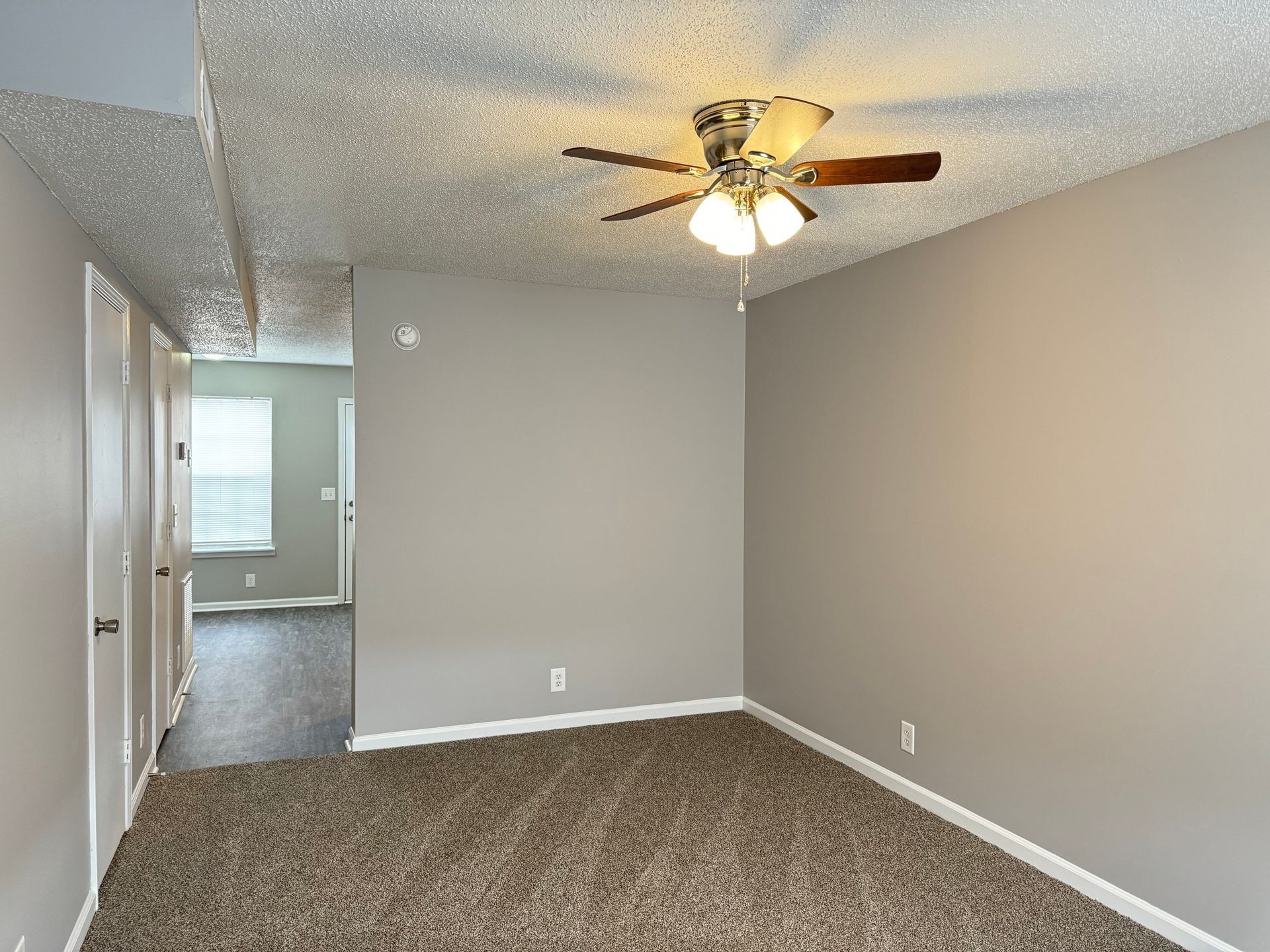 2453 Wilson Road, Unit 4 Clarksville, TN 37043 - Photo 3 of 20 an empty room with closet and a chandelier fan