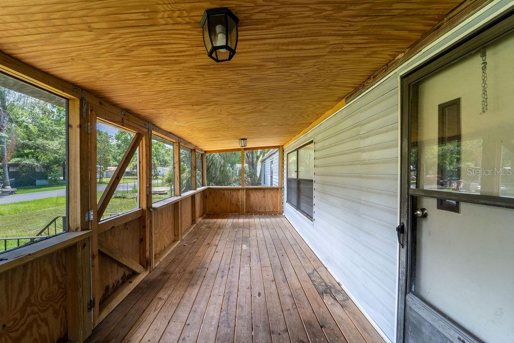 24031 Armadillo Road Astor, FL 32102 - Photo 4 of 43 a view of a balcony with wooden floor