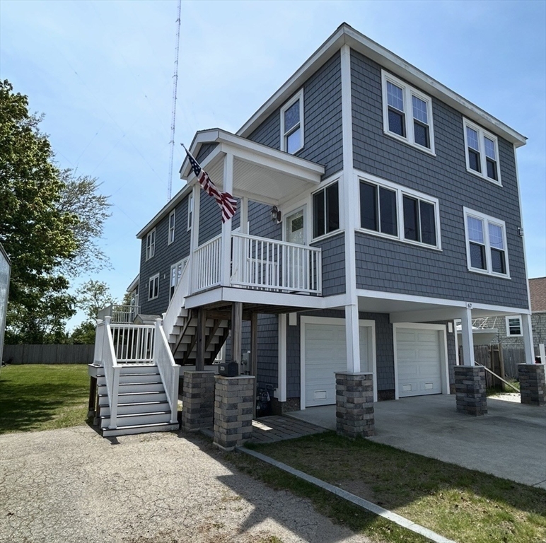 67 Newport Road Hull, MA 02045 - Photo 24 of 26 a front view of a house with garden