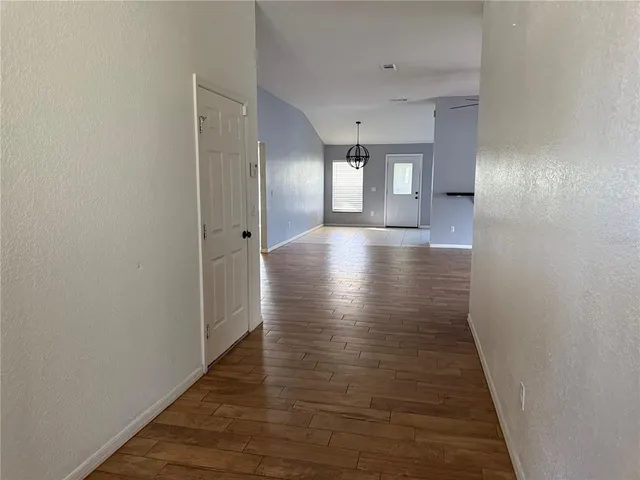 a view of gallery with wooden floor