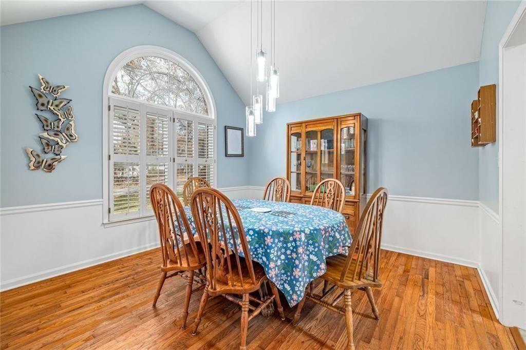 4609 Hunters Court Gainesville, GA 30507 - Photo 11 of 46 a view of a dining room with furniture window and wooden floor