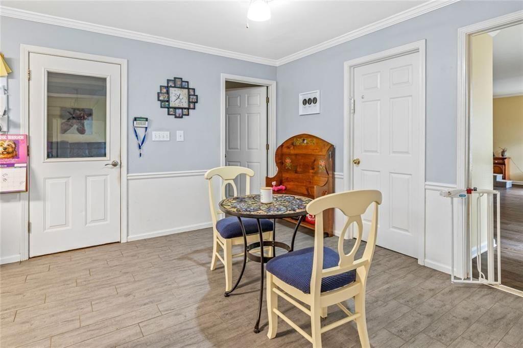4609 Hunters Court Gainesville, GA 30507 - Photo 15 of 46 a view of a dining room with furniture and wooden floor