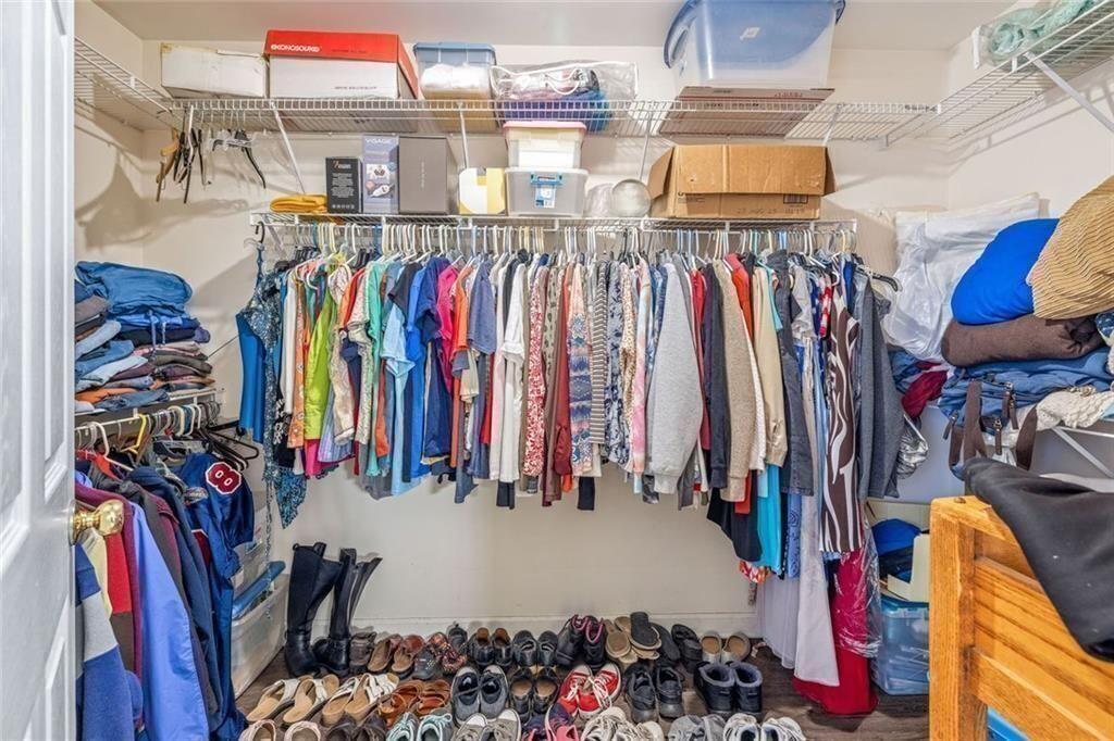 4609 Hunters Court Gainesville, GA 30507 - Photo 21 of 46 a view of walk in closet with clothes