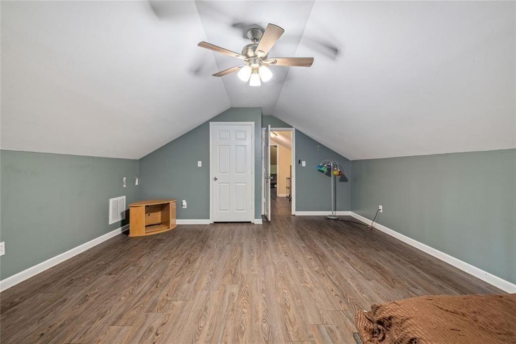 4609 Hunters Court Gainesville, GA 30507 - Photo 29 of 46 wooden floor in an empty room with a window