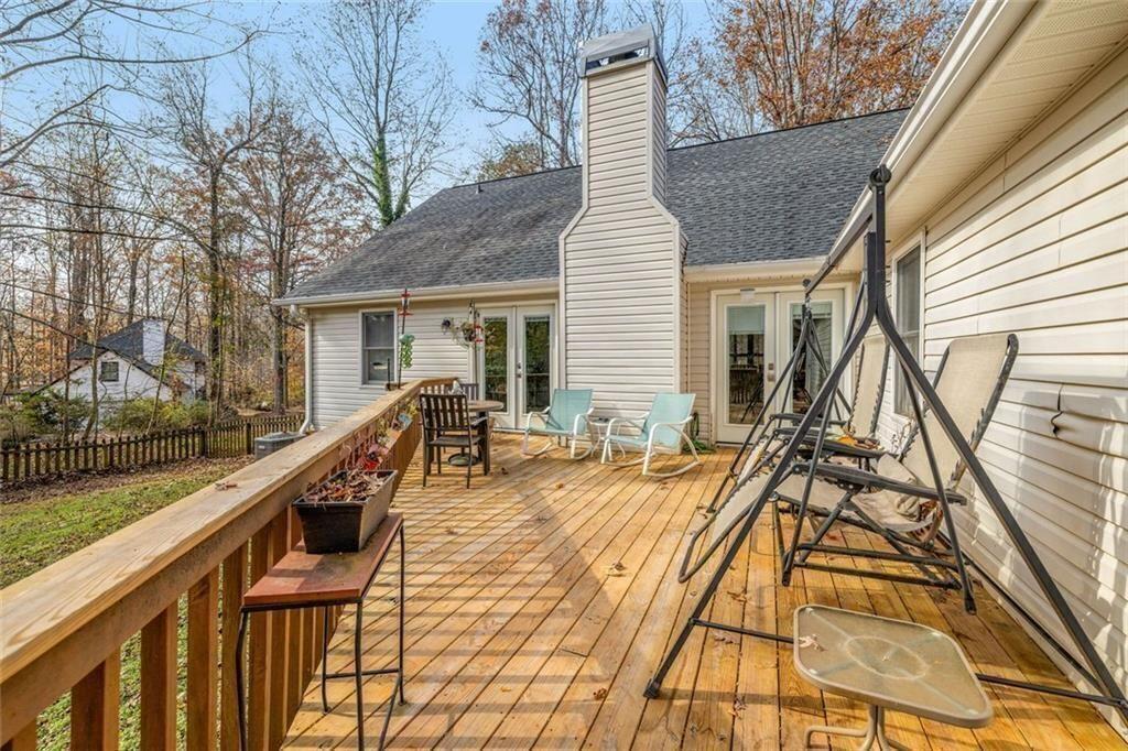 4609 Hunters Court Gainesville, GA 30507 - Photo 33 of 46 a view of a house with backyard and deck