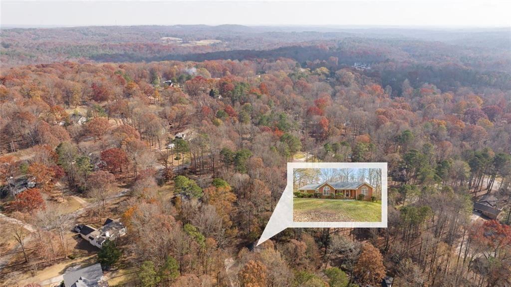 4609 Hunters Court Gainesville, GA 30507 - Photo 41 of 46 a view of a wooden wall with a mountain in the background