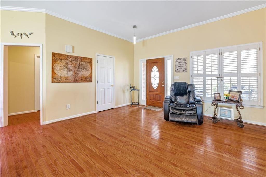 4609 Hunters Court Gainesville, GA 30507 - Photo 10 of 46 a living room with furniture and a wooden floor
