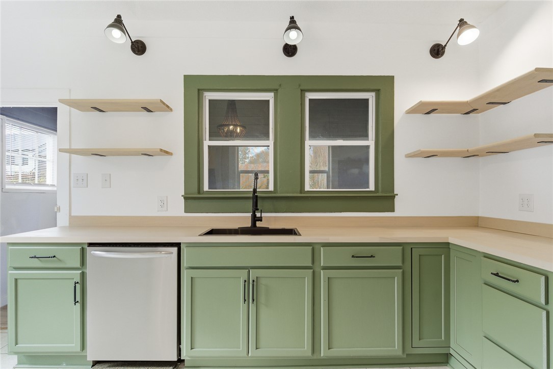 404 South Gossett Street Anderson, SC 29624 - Photo 16 of 50 Upgrades throughout the kitchen - new cabinets, butcher block counter tops, lighting, fixtures and more!