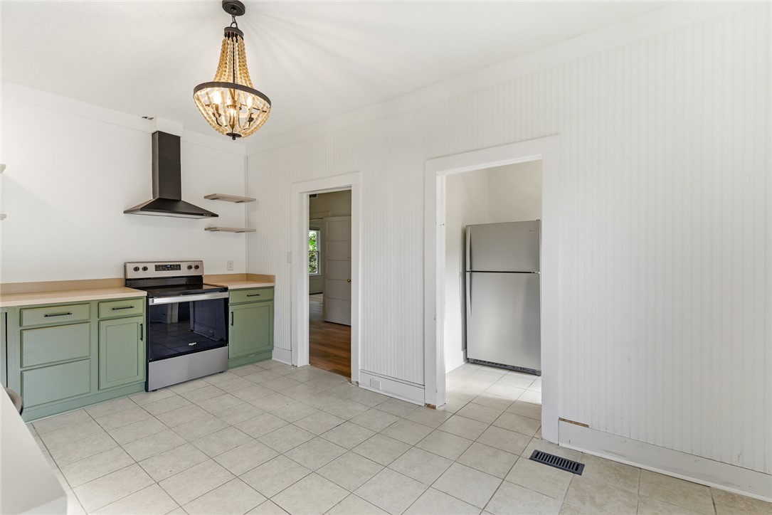 404 South Gossett Street Anderson, SC 29624 - Photo 21 of 50 Kitchen from the back entrance, with butler's pantry to the right