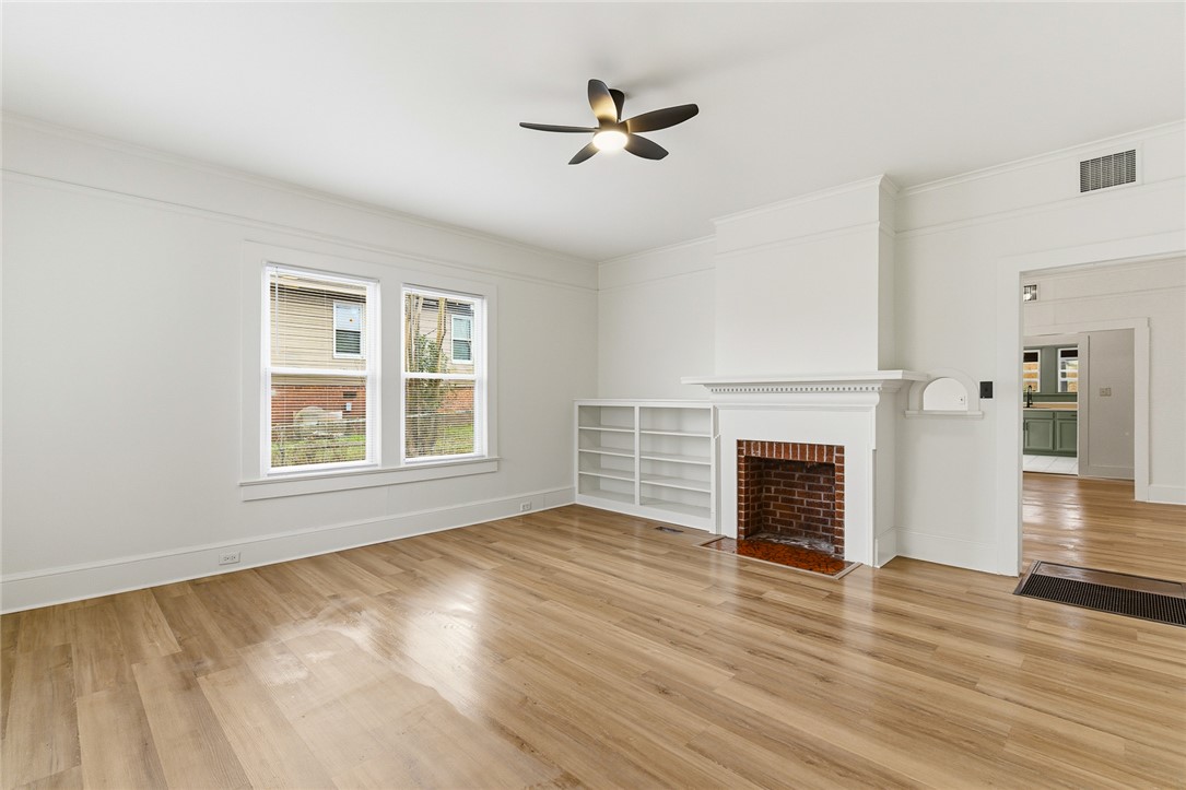 404 South Gossett Street Anderson, SC 29624 - Photo 5 of 50 Spacious living room with fireplace and shelving