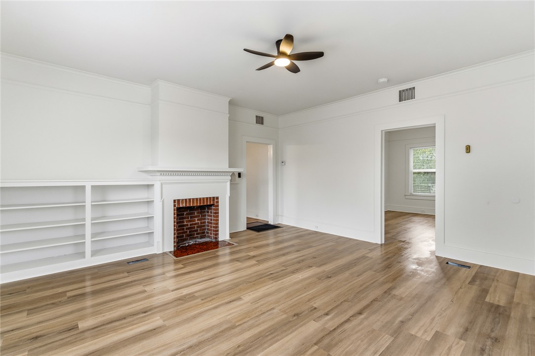 404 South Gossett Street Anderson, SC 29624 - Photo 6 of 50 Living room includes ceiling fan, fireplace and shelving