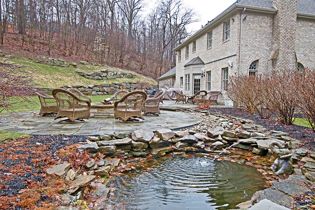 2219 Montgomery Road Sewickley, PA 15143 - Photo 23 of 24 Backyard view of patio fire pit, pond, and lovely scenery! How relaxing is that?