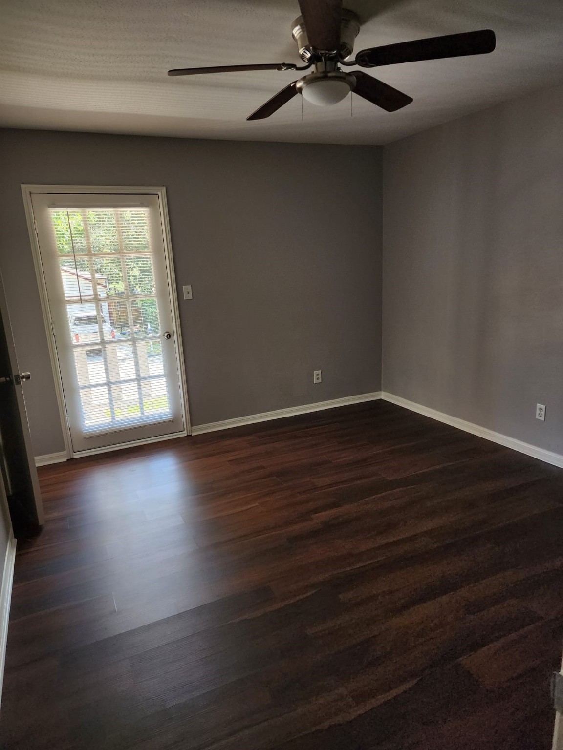 241 St Cloud Drive Friendswood, TX 77546 - Photo 12 of 12 an empty room with wooden floor fan and windows