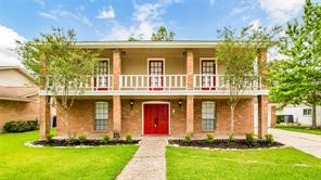 241 St Cloud Drive Friendswood, TX 77546 - Photo 2 of 12 a front view of a house with a yard