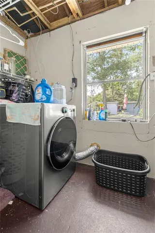 a room with gym equipment and a large window