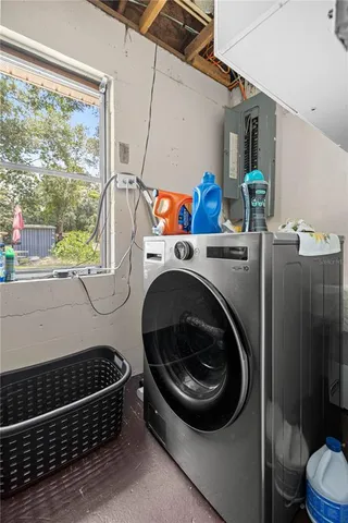 a utility room with dryer and washer