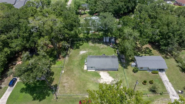 an aerial view of residential house with outdoor space