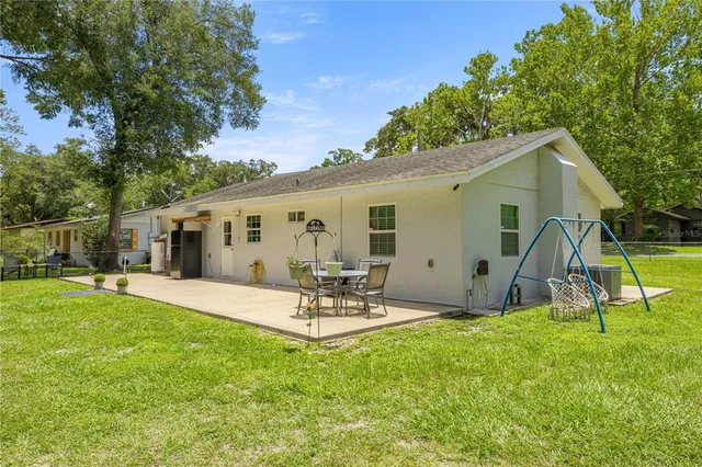 a view of a backyard and a patio