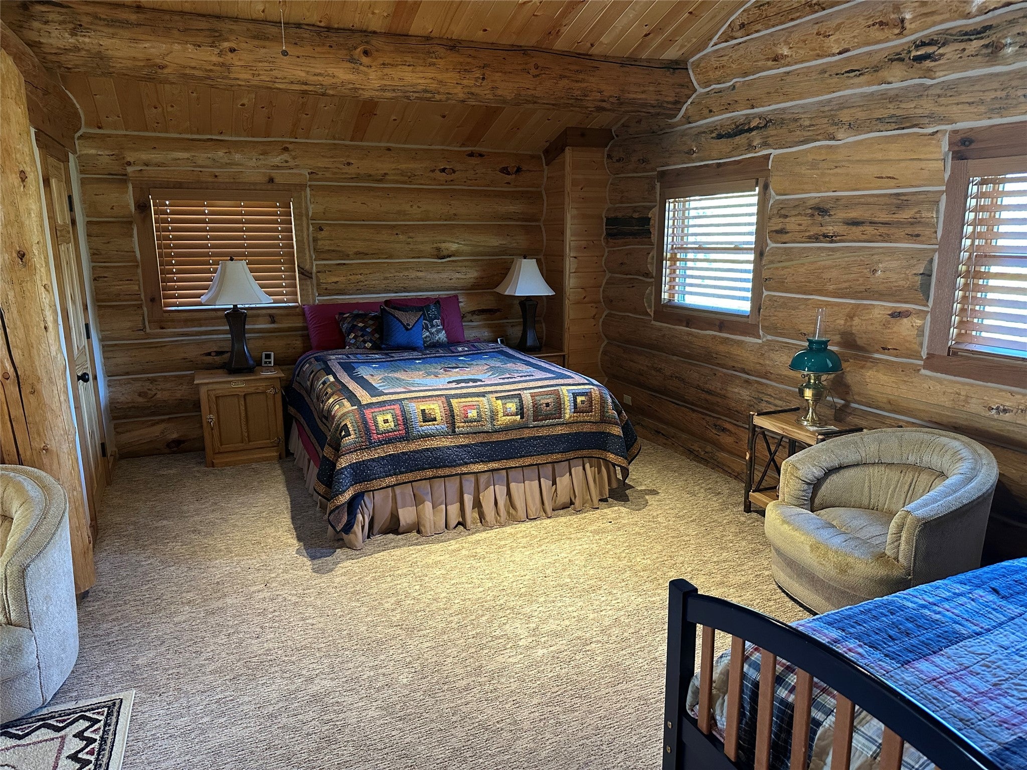 3916 Main Boulder Road McLeod, MT 59052 - Photo 31 of 38 Bedroom with wood ceiling, carpet, and log walls