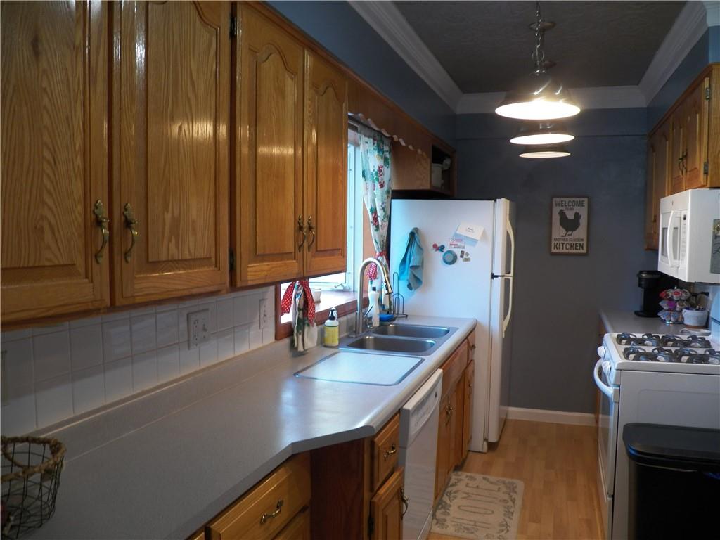 600 Sarver Road Sarver, PA 16055 - Photo 4 of 19 a kitchen with stainless steel appliances a sink stove and cabinets