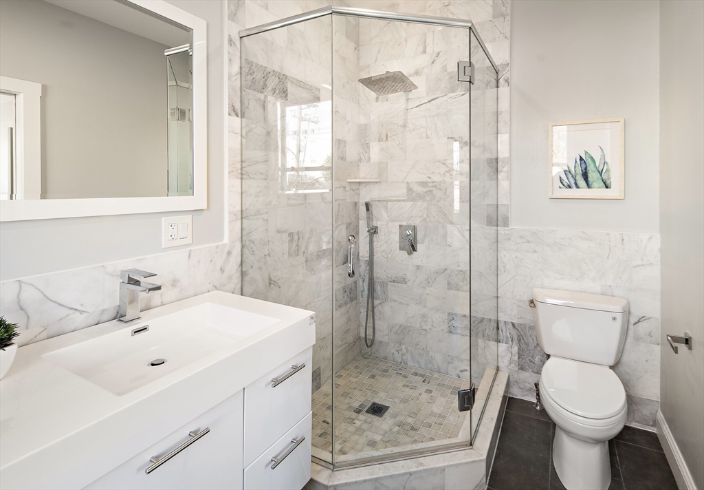 9-11 Boynton Street, Unit 2 Boston, MA 02130 - Photo 14 of 30 a bathroom with a sink toilet and shower