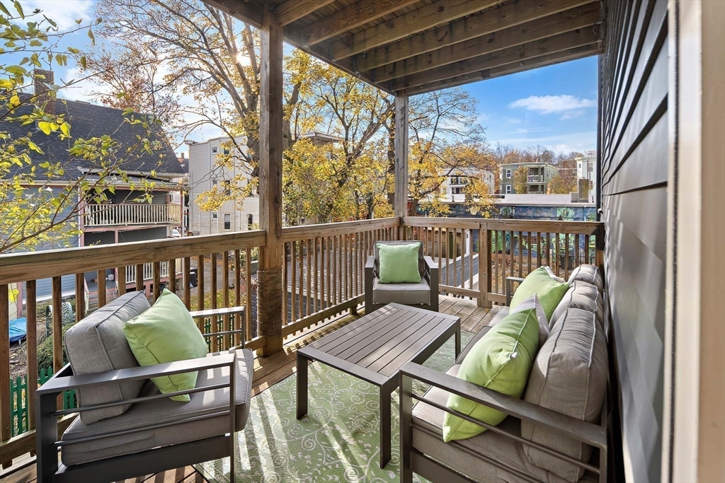 9-11 Boynton Street, Unit 2 Boston, MA 02130 - Photo 18 of 30 a view of a chairs in wooden deck