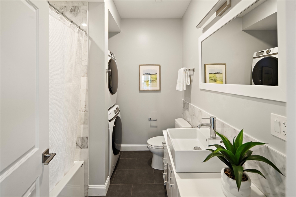 9-11 Boynton Street, Unit 2 Boston, MA 02130 - Photo 21 of 30 a bathroom with a sink toilet and shower