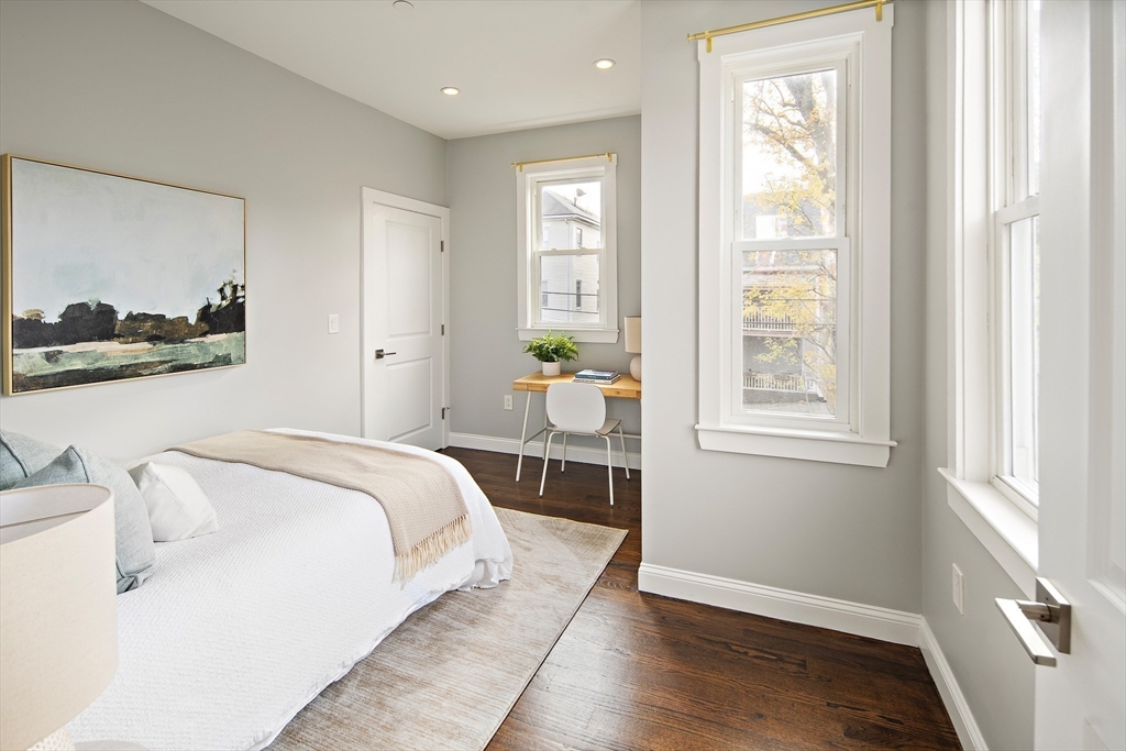 9-11 Boynton Street, Unit 2 Boston, MA 02130 - Photo 23 of 30 a spacious bedroom with a bed and window