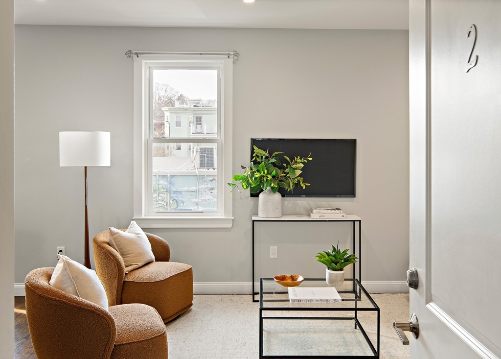 9-11 Boynton Street, Unit 2 Boston, MA 02130 - Photo 26 of 30 a living room with furniture flowerpot and a potted plant